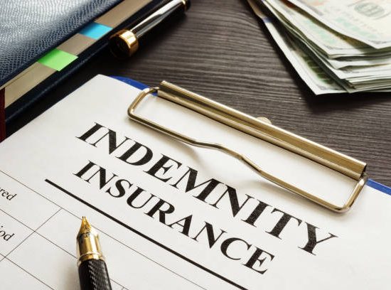 Indemnity insurance policy on the table.